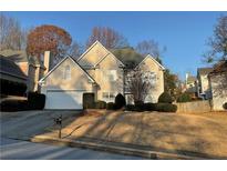 Beautiful two-story house with a two-car garage and manicured lawn at 1405 Boundary Blvd, Suwanee, GA 30024