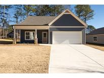 Charming craftsman-style home with a covered front porch and attached garage at 318 Forkview Dr, Lawrenceville, GA 30044