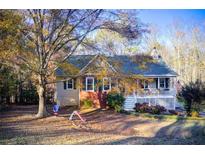 Charming two-story home nestled among trees with a front porch and swing set at 4910 Tahoe Ct, Winston, GA 30187