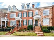Charming brick townhome with green shutters and inviting front porch at 4754 Ivy Ridge Se Dr # 1, Atlanta, GA 30339