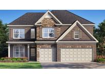 Two-story home with stone and brick exterior, a two-car garage, and landscaping at 3834 Kastler Dr, South Fulton, GA 30349