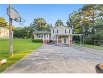 Charming single-Gathering home with a covered carport and large front yard at 680 Horsley Mill Rd, Carrollton, GA 30116