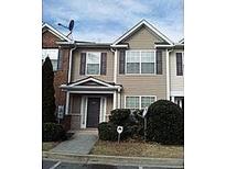 Attractive two-story townhome with a welcoming front entrance and landscaped shrubs at 2920 Vining Ridge Ter, Decatur, GA 30034