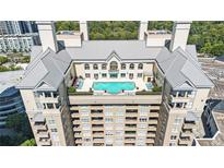 Expansive rooftop pool and lounge area with city views at 3334 Peachtree Ne Rd # 908, Atlanta, GA 30326