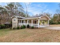 Ranch style home with covered porch and carport at 3435 Misty Valley Rd, Decatur, GA 30032