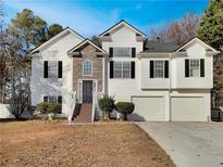 Charming two-story home with a three-car garage and inviting front entrance at 125 Cedars Glen Cir, Villa Rica, GA 30180