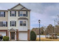 Two-story townhome with attached garage and landscaping at 6798 Blackstone Pl # 12, Mableton, GA 30126