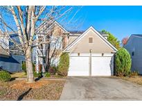 Two-story house with two-car garage and landscaped yard at 3282 Victoria Sw Park, Atlanta, GA 30331