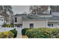 Updated townhome with neutral exterior and a well-manicured front yard at 2683 Meadowlawn Se Dr, Marietta, GA 30067