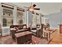 Spacious living room with hardwood floors and city views at 57 Forsyth Nw St # 4D, Atlanta, GA 30303