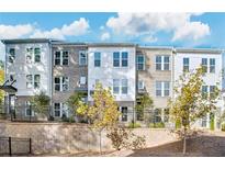Modern townhome community with gray brick and white accents at 1923 Rogers Ct, Atlanta, GA 30318