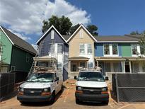 New townhouses with varying siding colors and two-car parking at 1095 Tucker Ave # 405, Atlanta, GA 30310