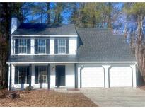 Two-story house with white siding, black shutters, and a two-car garage at 2759 Kerri Pl, Lithia Springs, GA 30122