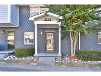 Brick front exterior with covered entryway and landscaping at 3149 Buford Ne Hwy # 7, Atlanta, GA 30329
