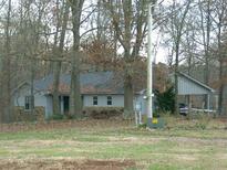 Ranch home nestled among trees, offering a peaceful setting at 4345 Wellington Pl, Cumming, GA 30040