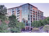 Modern multi-story building with glass accents and landscaping at 905 Juniper Ne St # 110, Atlanta, GA 30309