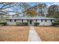 Gray ranch house with walkway and landscaping at 844 Parkstone Dr, Stone Mountain, GA 30083