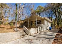 Ranch house with covered porch, steps, and a spacious yard at 2168 Polar Rock Sw Pl, Atlanta, GA 30315