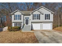 Two-story house with gray siding and a two-car garage at 3851 Kenner Sw Dr, Atlanta, GA 30331