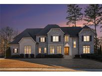 Brick two-story house with gray roof and landscaping at 3862 Stratford Park Ne Dr, Atlanta, GA 30342