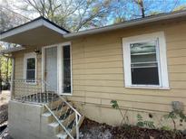 Ranch style home with steps leading to the front door and large windows at 4195 Blanton Sw Ave, Atlanta, GA 30331