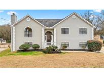 Two-story house with gray siding, landscaping, and a spacious yard at 6764 Creek Valley Way, Douglasville, GA 30134