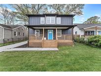 Newly renovated two-story home with a charming front porch and landscaped lawn at 2447 Lynn Iris Dr, Decatur, GA 30032