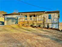 Newly renovated single-story home with a large front porch and attached garage at 2535 Impala Dr, Cumming, GA 30041