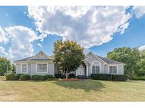 Ranch style home with gray siding, landscaping, and a spacious lawn at 5170 Stone Croft Trl, Atlanta, GA 30331
