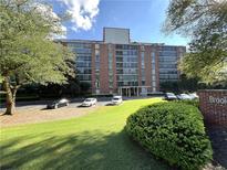 Brick building with ample parking and landscaping at 130 26Th Nw St # 808, Atlanta, GA 30309