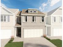 Brick front exterior of charming two-story townhome with two-car garage at 723 Cygnet Ln, Grayson, GA 30017