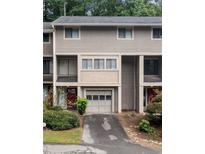 Two-story townhome with attached garage and landscaping at 2927 Torreya Se Way, Marietta, GA 30067