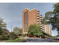 Brick building exterior with landscaping and parking at 300 Johnson Ferry Rd # B711, Atlanta, GA 30328