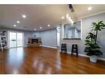 Spacious living room with hardwood floors, fireplace, and access to a balcony at 970 Sidney Marcus Ne Blvd # 1316, Atlanta, GA 30324