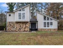 Charming two-story house with stone accents and a landscaped lawn at 5444 Wylstream, Norcross, GA 30093