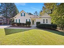 House exterior featuring a well-maintained lawn and neutral siding at 5555 Christi Dr, Douglasville, GA 30135