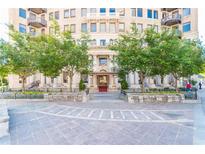 Elegant building exterior with grand entrance and landscaping at 75 Ponce De Leon Ne Ave # 1010, Atlanta, GA 30308