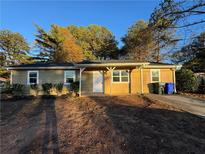 Updated ranch home with new windows, landscaping and driveway at 1851 Irwin Bridge Nw Rd, Conyers, GA 30012