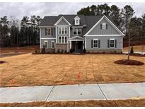 Two-story home with gray siding and a spacious lawn at 2722 Byess Ct, Marietta, GA 30064