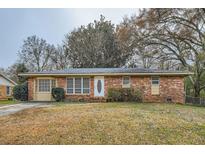 Brick ranch house with a well-maintained lawn at 1433 Sunnybrook Dr, Jonesboro, GA 30236