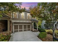 Attractive two-story home with a two-car garage and well-manicured landscaping at 6288 Village Arbor Ln, Mableton, GA 30126