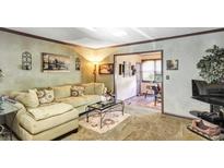 Spacious living room featuring a comfortable sectional sofa and large windows at 68 Montre Nw Sq, Atlanta, GA 30327