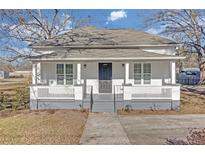 Charming renovated cottage with a front porch and new landscaping at 1794 Spring Ne St, Conyers, GA 30012