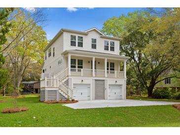 Two story home with two car garage and front porch at 1069 Capersview Ct, Awendaw, SC 29429