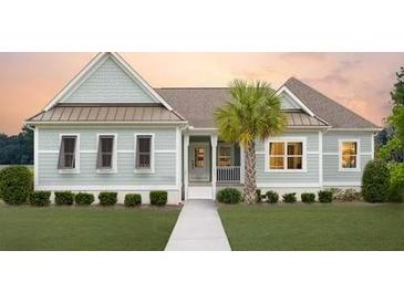 Charming one-story home with light gray siding, a walkway, and lush landscaping at 615 Faulkner Dr, Mount Pleasant, SC 29466