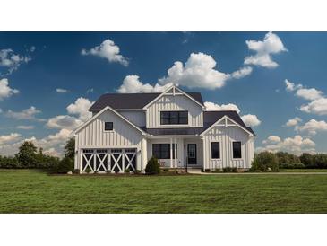 Two-story farmhouse with white siding, a dark roof, and a three-car garage at 639 Faulkner Dr, Mount Pleasant, SC 29466