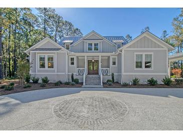 Charming house with gray siding and circular driveway at 19 Bradley Pasture Way, Ravenel, SC 29470