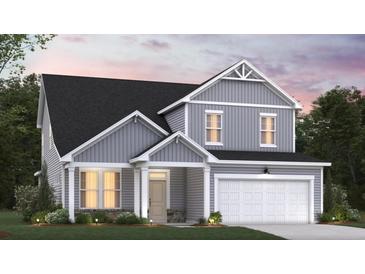 Two-story home with gray siding and a white garage door at 4000 Winding Grove Ln, Moncks Corner, SC 29461