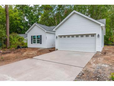 New construction home with white siding and a two-car garage at 105 Equestrian Ct, Summerville, SC 29486