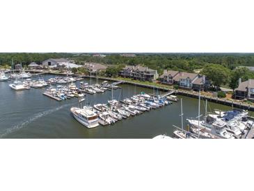 Aerial view of waterfront homes and marina at 1955 Marsh Oak Ln, Johns Island, SC 29455